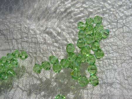 bicone 3 mm: peridot Xilion