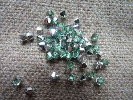 sw bicone 4 mm chrysolite CAL Xilion
